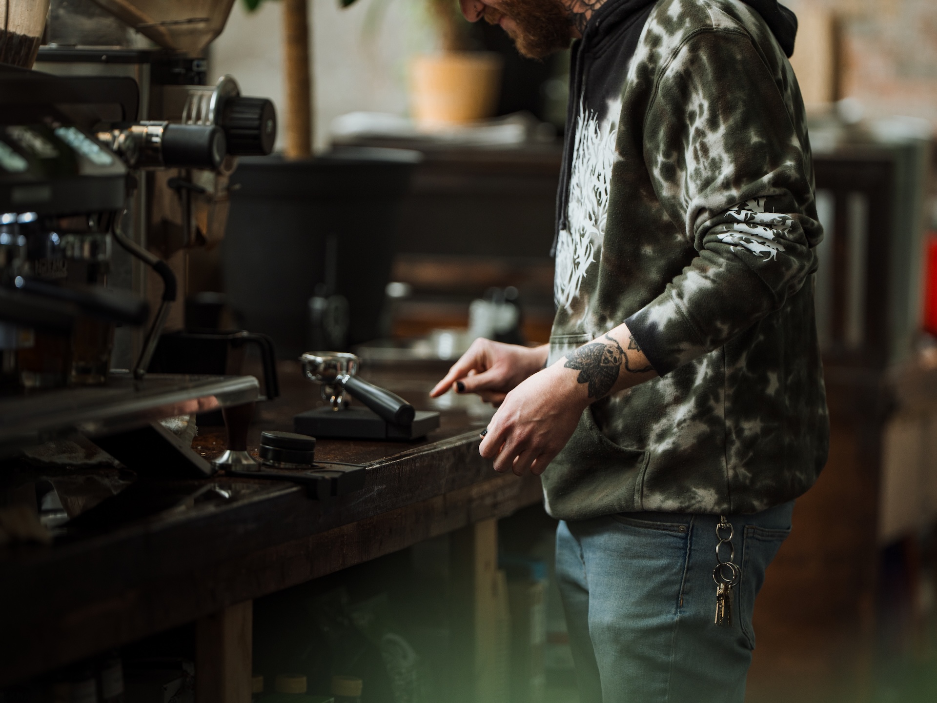 Barista crafting an espresso at the bar